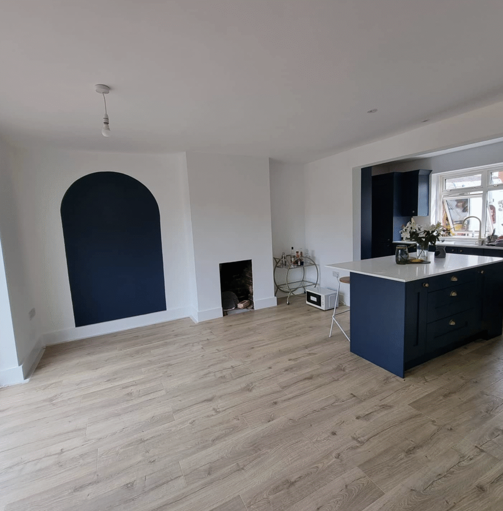 Additional view of a blue and white professionally decorated kitchen and dining area with modern finishes