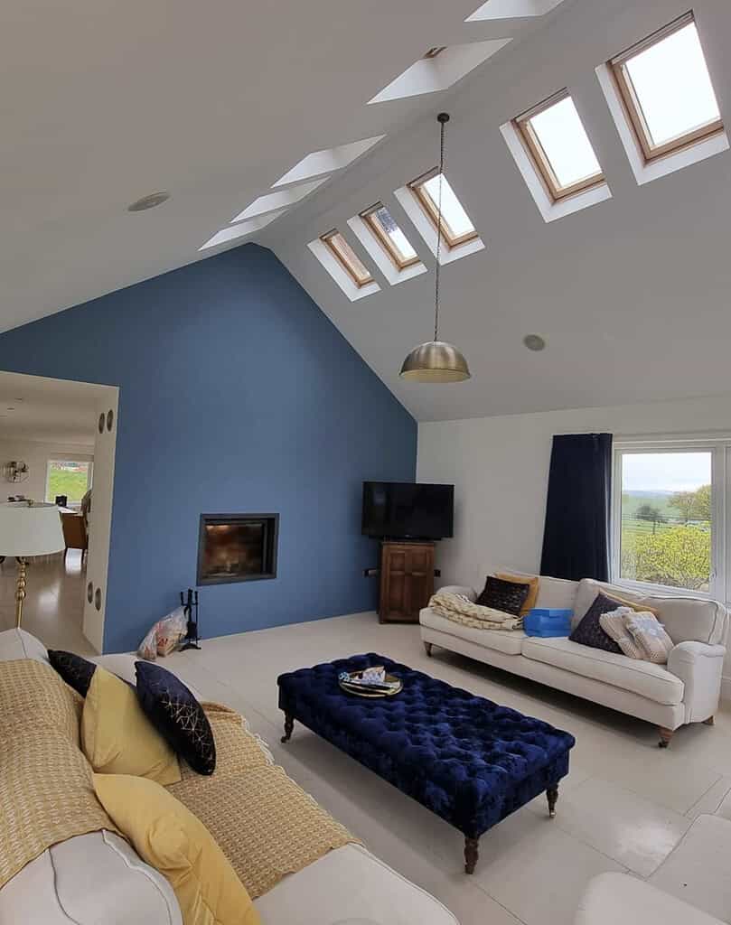 Side view of a freshly decorated lounge with smooth paintwork and modern interior finishes
