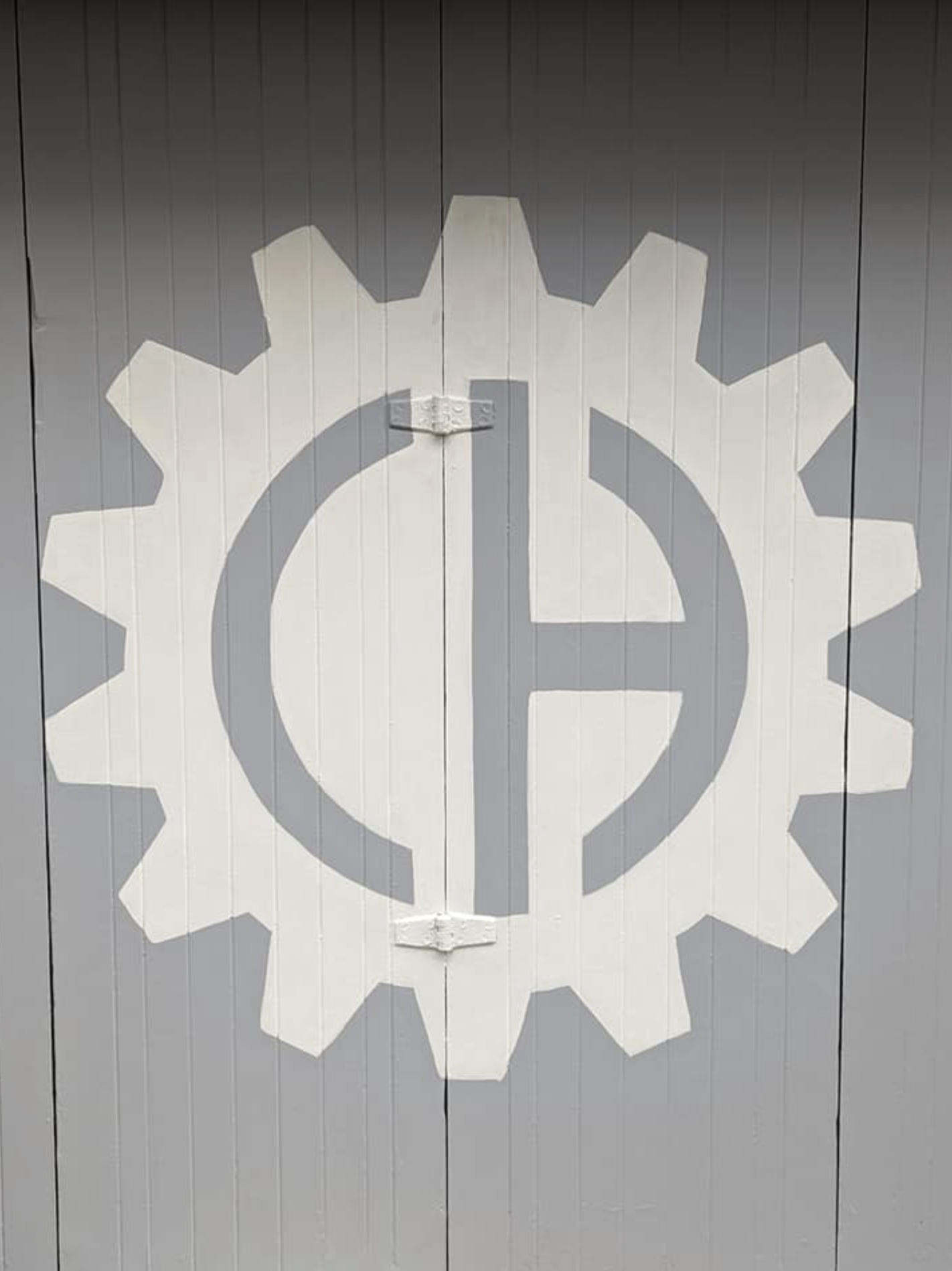Painted wall surrounding Crankhouse Coffee logo