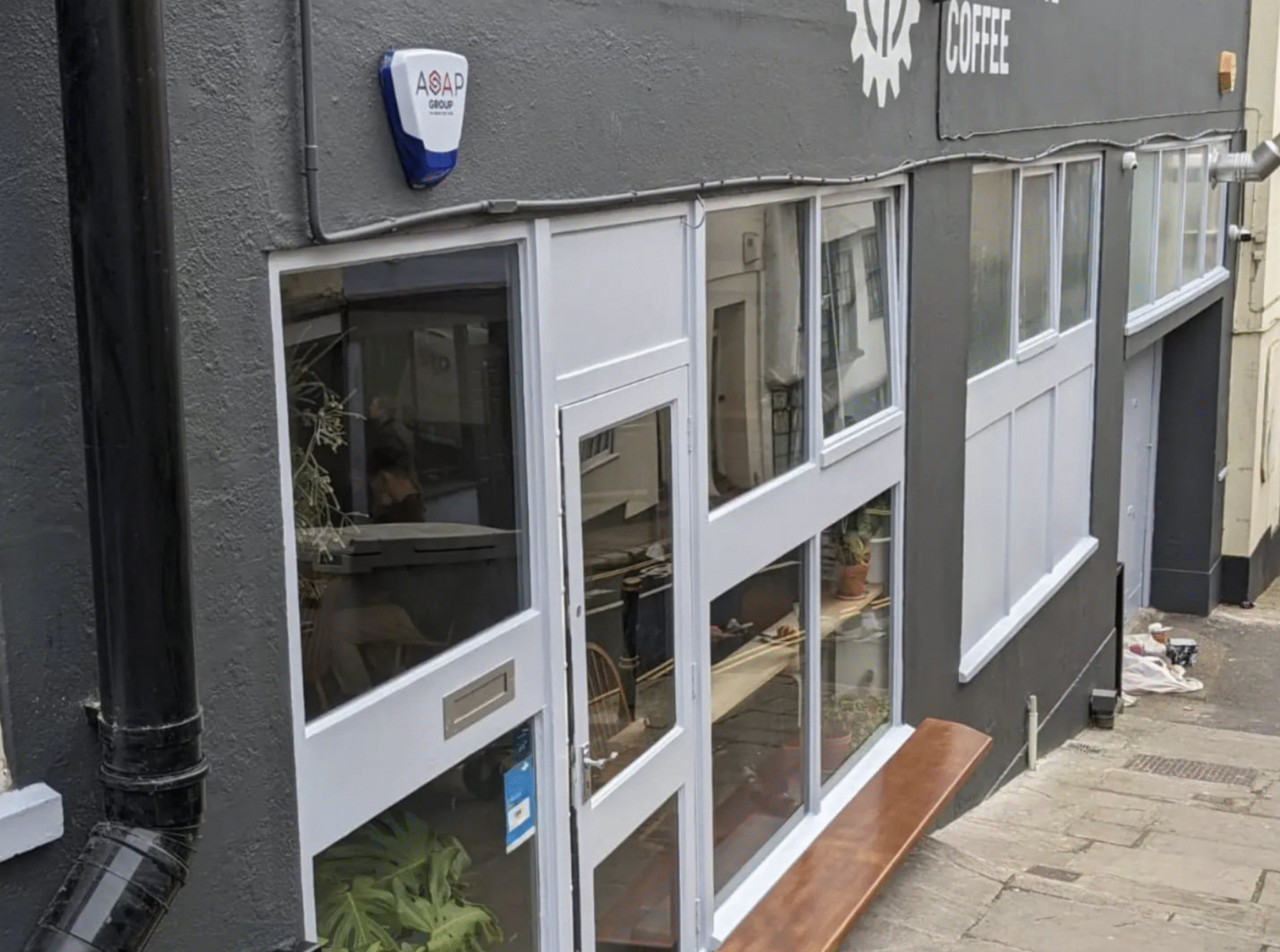 Side-angle view of Crankhouse Coffee’s repainted exterior walls