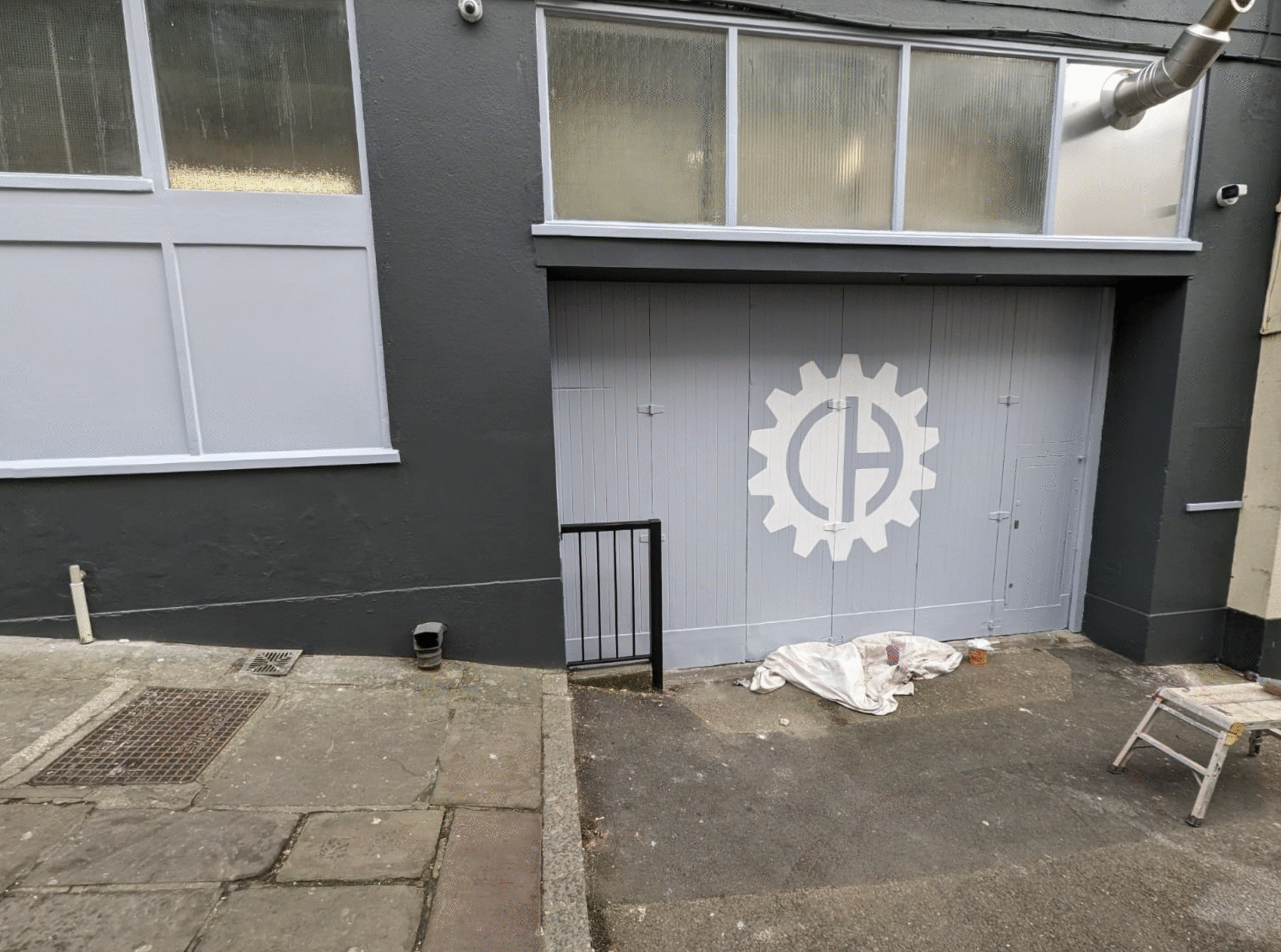 Freshly painted window surrounds on coffee shop exterior