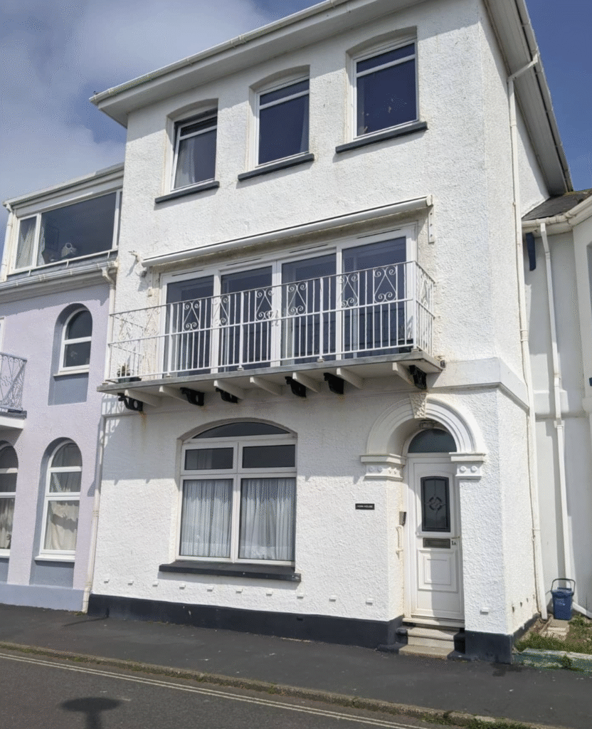 Full front view of a house after professional exterior painting work