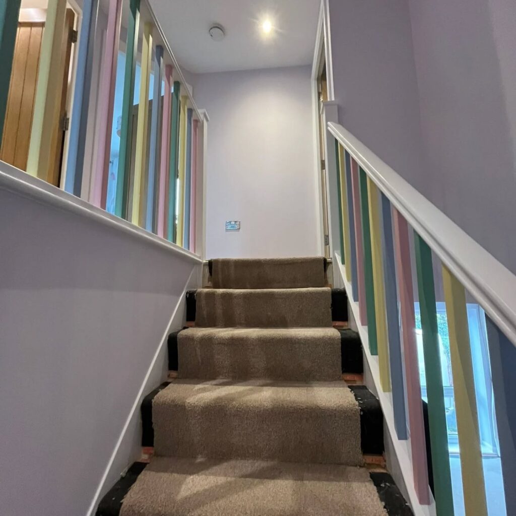 Freshly decorated stairwell with smooth walls and neat finishes