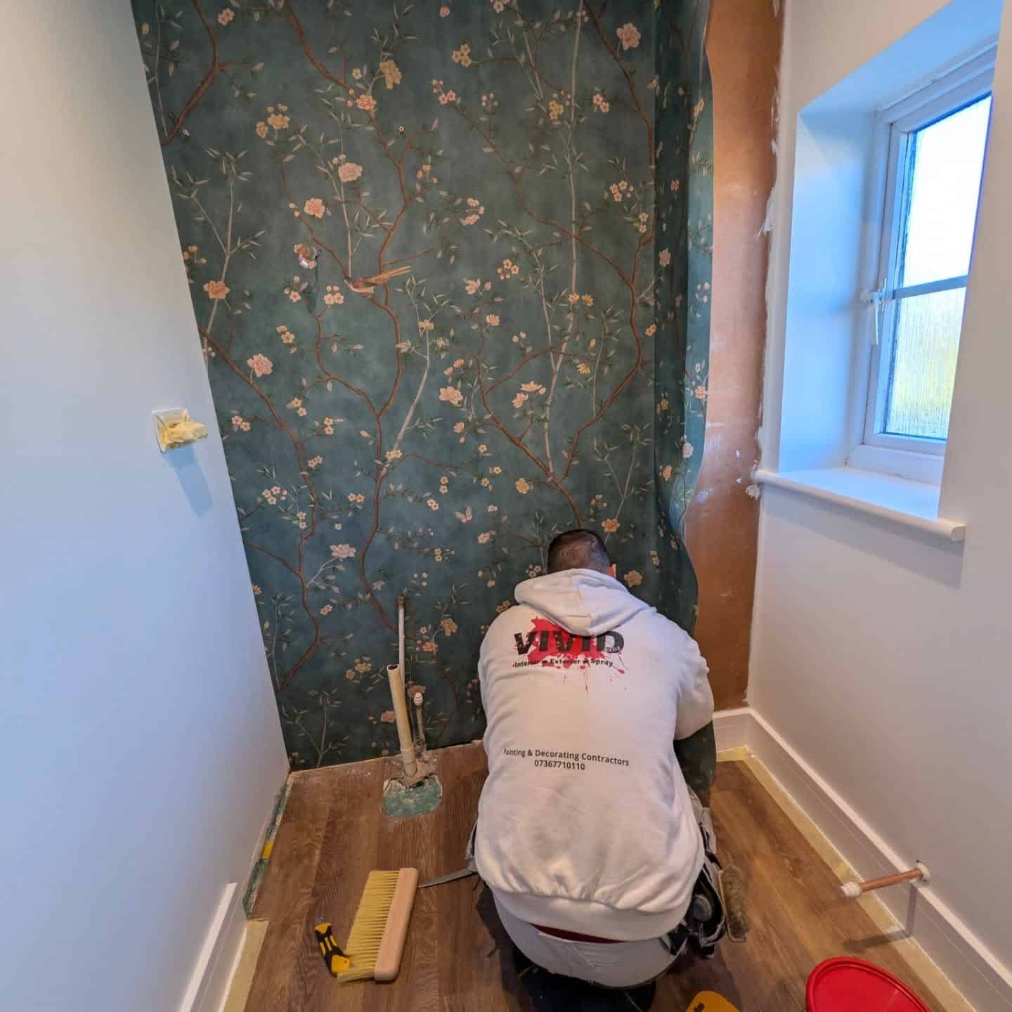 Decorating a bathroom with a floral mural in Exeter, Devon.